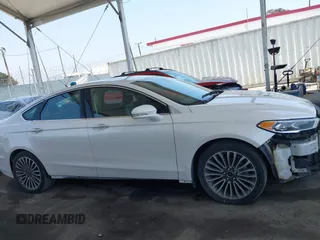 2017 Ford Fusion Hybrid Titanium with VIN 3FA6P0RU8HR229653, listed as a IAAI auction lot 42445182 with 163,279 mi miles and . Bid and sale history available at DreamBid. Image 13.