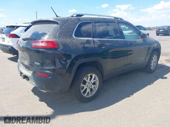2015 Jeep Cherokee Latitude with VIN 1C4PJMCS3FW545440, listed as a IAAI auction lot 42268676 with 197,192 mi miles and . Bid and sale history available at DreamBid. Image 4.