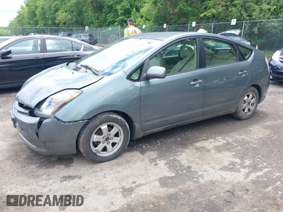 2005 Toyota Prius z VIN JTDKB20U853125464, wystawiony jako IAAI lot #42324259 z przebiegiem 166 742 mil mil oraz . Historia ofert i sprzedaży dostępna na DreamBid. Obrazek 2.