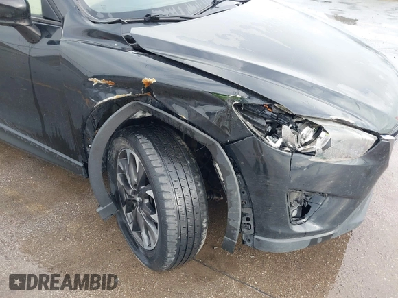 2016 Mazda CX-5 Grand Touring with VIN JM3KE4DY3G0769448, listed as a IAAI auction lot 41947725 with 154,051 mi miles and . Bid and sale history available at carsss.com. Image 17.