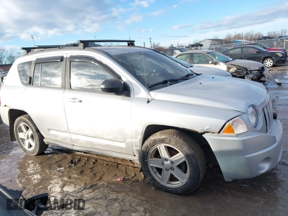 2010 Jeep Compass Sport with VIN 1J4NF4FB3AD589361, listed as a IAAI auction lot 41449412 with 127,807 mi miles. Bid and sale history available at carsss.com. Image 12.