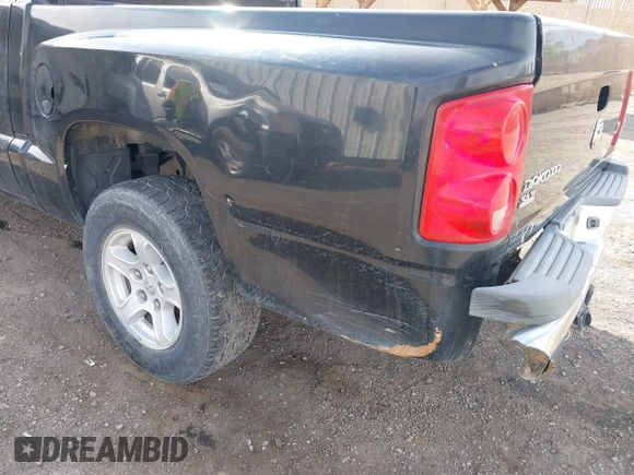 2006 Dodge Dakota SLT with VIN 1D7HE48NX6S596684, listed as a IAAI auction lot 41992956 with 255,526 mi miles and . Bid and sale history available at carsss.com. Image 6.