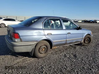 1999 Toyota Tercel z VIN JT2BC53L9X0354072, wystawiony jako Copart lot #73050384 z przebiegiem 163 566 mil mil oraz Szkody całkowita. Historia ofert i sprzedaży dostępna na DreamBid. Obrazek 3.