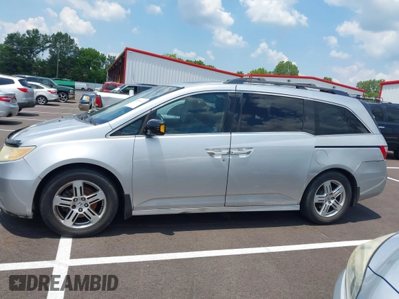 2011 Honda Odyssey Touring with VIN 5FNRL5H99BB058448, listed as a IAAI auction lot 42651432 with 208,581 mi miles and . Bid and sale history available at DreamBid. Image 14.