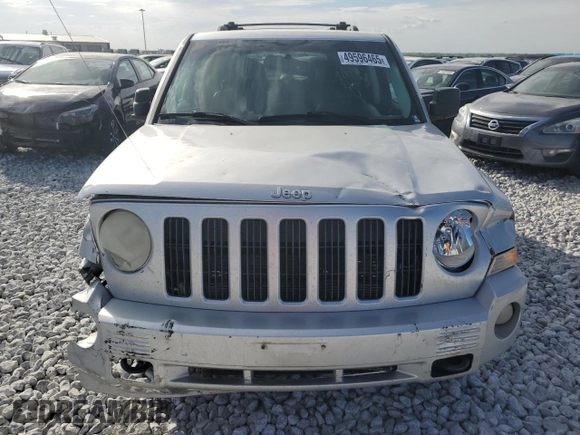 2009 Jeep Patriot with VIN 1J8FF48B49D221606, listed as a Copart auction lot 49596465 with 168,305 mi miles and Salvage title. Bid and sale history available at DreamBid. Image 5.