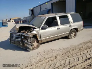 1999 Chevrolet Tahoe with VIN 1GNEC13R4XJ527256, listed as a Copart auction lot 76914724 with 173,550 mi miles and Salvage Title. Bid and sale history available at carsss.com. Image 1.