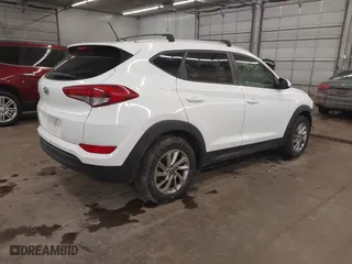 2016 Hyundai Tucson SE with VIN KM8J33A48GU117807, listed as a IAAI auction lot 41642891 with 142,371 mi miles. Bid and sale history available at carsss.com. Image 4.