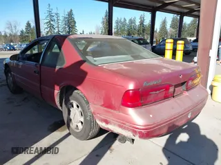 1997 Ford Thunderbird LX with VIN 1FALP6247VH138208, listed as a IAAI auction lot 41562980 with 135,204 mi miles and . Bid and sale history available at DreamBid. Image 3.