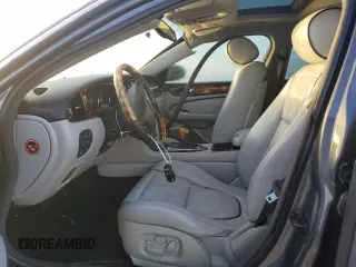 2004 Jaguar XJ with VIN SAJEA74C24SG09038, listed as a Copart auction lot 77015544 with Not Provided miles and Salvage Title. Bid and sale history available at DreamBid. Image 7.