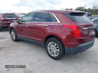 2017 Cadillac XT5 FWD with VIN 1GYKNARS2HZ107587, listed as a IAAI auction lot 41614842 with 124,611 mi miles and . Bid and sale history available at carsss.com. Image 3.