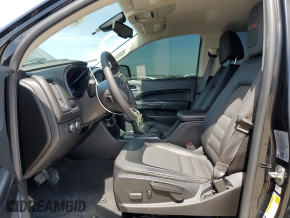 2021 GMC Canyon 4WD AT4 w/Leather with VIN 1GTG6FEN3M1274409, listed as a Copart auction lot 49228145 with 57,194 mi miles and Salvage Title. Bid and sale history available at carsss.com. Image 7.