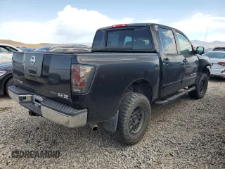 2010 Nissan Titan XE with VIN 1N6BA0EJ5AN318639, listed as a Copart auction lot 69776984 with 158,913 mi miles and Salvage Title. Bid and sale history available at carsss.com. Image 3.