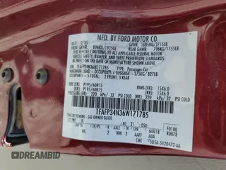 2006 Ford Focus S z VIN 1FAFP34N36W171785, wystawiony jako Copart lot #55815195 z przebiegiem 164 074 mil mil oraz Szkoda całkowita • Salvage title. Historia ofert i sprzedaży dostępna na DreamBid. Obrazek 12.