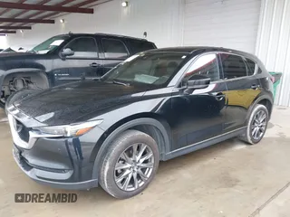 2021 Mazda CX-5 Signature with VIN JM3KFBEY5M0432033, listed as a IAAI auction lot 41607215 with 49,870 mi miles. Bid and sale history available at carsss.com. Image 17.