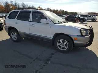 2002 Hyundai Santa Fe GLS with VIN KM8SC13D42U162953, listed as a Copart auction lot 77953044 with 98,463 mi miles and Clean Title. Bid and sale history available at carsss.com. Image 4.