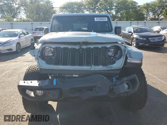 2024 Jeep Wrangler Rubicon z VIN 1C4RJXR64RW279791, wystawiony jako Copart lot #61348324 z przebiegiem 1 387 mil mil oraz Szkoda całkowita • Salvage title. Historia ofert i sprzedaży dostępna na DreamBid. Obrazek 5.