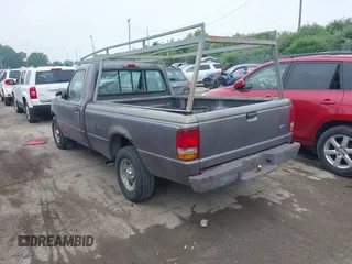 1997 Ford Ranger XLT z VIN 1FTCR10A1VTA93179, wystawiony jako IAAI lot #42444951 z przebiegiem 201 990 mil mil oraz . Historia ofert i sprzedaży dostępna na DreamBid. Obrazek 3.