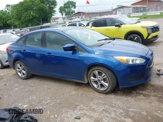 2018 Ford Focus SE z VIN 1FADP3F21JL212029, wystawiony jako IAAI lot #42258350 z przebiegiem 91 939 mil mil oraz . Historia ofert i sprzedaży dostępna na DreamBid. Obrazek 13.