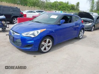 2014 Hyundai Veloster with VIN KMHTC6AD2EU184927, listed as a IAAI auction lot 42133499 with 103,499 mi miles. Bid and sale history available at carsss.com. Image 2.