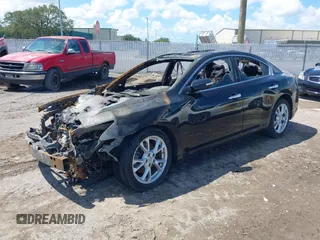 2014 Nissan Maxima S with VIN 1N4AA5AP5EC477030, listed as a IAAI auction lot 42104484 with 116,035 mi miles and . Bid and sale history available at DreamBid. Image 2.