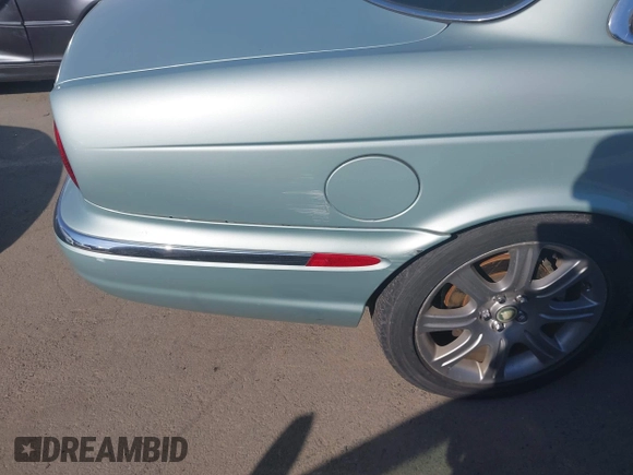 2004 Jaguar XJ 8 with VIN SAJEA71CX4SG10751, listed as a IAAI auction lot 42149348 with 89,786 mi miles and . Bid and sale history available at DreamBid. Image 14.