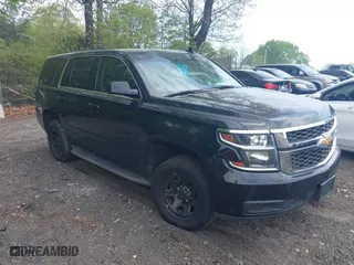 2019 Chevrolet Tahoe Commercial with VIN 1GNLCDECXKR208052, listed as a IAAI auction lot 42014348 with 96,455 mi miles. Bid and sale history available at carsss.com. Image 1.