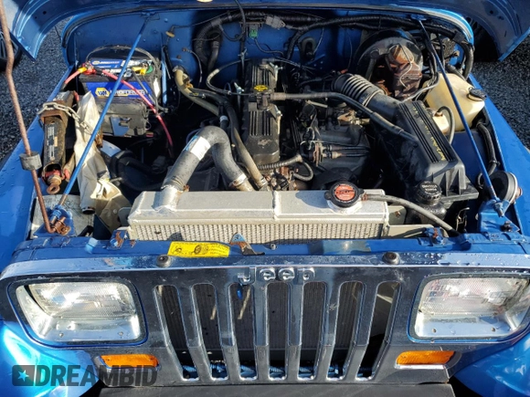 1992 Jeep Wrangler z VIN 2J4FY19P6NJ559597, wystawiony jako Copart lot #74990384 z przebiegiem 150 298 mil mil oraz Szkoda całkowita • Salvage title. Historia ofert i sprzedaży dostępna na DreamBid. Obrazek 11.