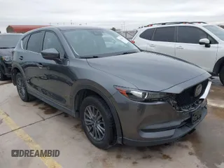2021 Mazda CX-5 Touring with VIN JM3KFBCM0M0342210, listed as a IAAI auction lot 41236013 with 96,012 mi miles. Bid and sale history available at carsss.com. Image 1.