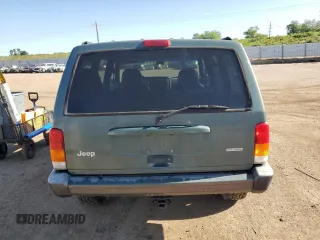 2000 Jeep Cherokee with VIN 1J4FF48S0YL198802, listed as a Copart auction lot 59996915 with 249,756 mi miles and Salvage title. Bid and sale history available at DreamBid. Image 6.