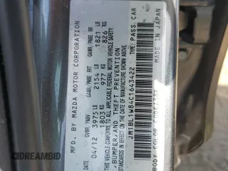 2012 Mazda 3 i Grand Touring with VIN JM1BL1W84C1643422, listed as a Copart auction lot 53557245 with 115,805 mi miles and Salvage Title. Bid and sale history available at DreamBid. Image 12.
