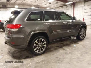 2017 Jeep Grand Cherokee Overland z VIN 1C4RJFCG6HC641812, wystawiony jako IAAI lot #42053404 z przebiegiem 129 184 mil mil oraz . Historia ofert i sprzedaży dostępna na DreamBid. Obrazek 4.