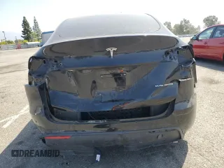 2024 Tesla Model Y Long Range with VIN 7SAYGDEE6RA219456, listed as a Copart auction lot 61855165 with 29,869 mi miles and Salvage title. Bid and sale history available at DreamBid. Image 6.