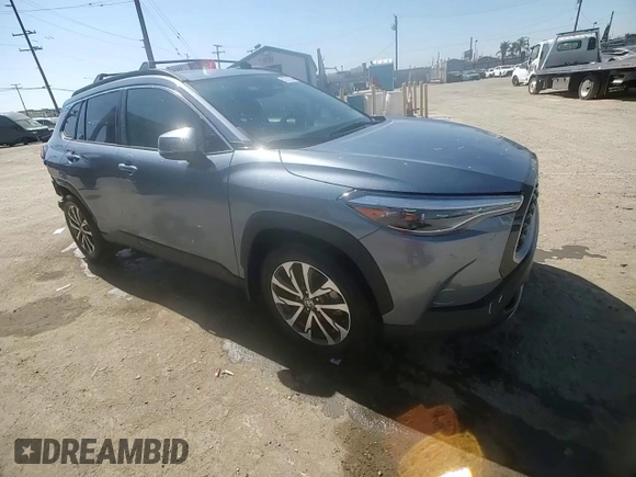 2023 Toyota Corolla Cross XLE with VIN 7MUDAAAG0PV063242, listed as a Copart auction lot 52511585 with 10,695 mi miles and Salvage title. Bid and sale history available at DreamBid. Image 12.
