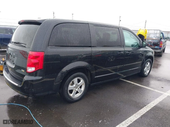 2011 Dodge Grand Caravan Mainstreet with VIN 2D4RN3DG1BR731727, listed as a IAAI auction lot 41820862 with 165,667 mi miles. Bid and sale history available at carsss.com. Image 4.