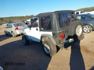 2004 Jeep Wrangler Sport Right Hand Drive with VIN 1J4F449S74P732854, listed as a IAAI auction lot 41408316 with 112,064 mi miles. Bid and sale history available at carsss.com. Image 3.