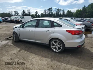 2015 Ford Focus Titanium with VIN 1FADP3J27FL285842, listed as a Copart auction lot 61159935 with 79,215 mi miles and Salvage title. Bid and sale history available at DreamBid. Image 2.