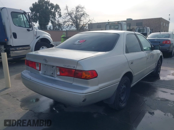 2001 Toyota Camry CE with VIN 4T1BG22KX1U867930, listed as a IAAI auction lot 41764995 with 216,679 mi miles. Bid and sale history available at carsss.com. Image 4.