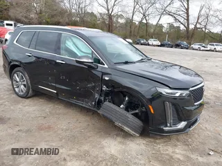 2023 Cadillac XT6 AWD Premium Luxury with VIN 1GYKPDRS1PZ149906, listed as a IAAI auction lot 41581975 with 52,450 mi miles and . Bid and sale history available at DreamBid. Image 1.