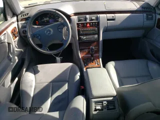 2001 Mercedes-Benz E-Class with VIN WDBJF65J01B325792, listed as a Copart auction lot 76328704 with 101,886 mi miles and Salvage Title. Bid and sale history available at carsss.com. Image 8.