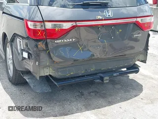 2013 Honda Odyssey Touring with VIN 5FNRL5H96DB068843, listed as a IAAI auction lot 42312176 with 115,804 mi miles and . Bid and sale history available at DreamBid. Image 6.