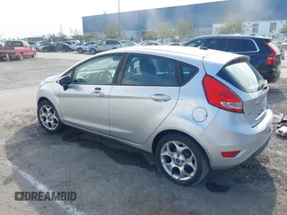 2011 Ford Fiesta SES with VIN 3FADP4FJ1BM102434, listed as a IAAI auction lot 41703287 with 124,476 mi miles. Bid and sale history available at carsss.com. Image 3.
