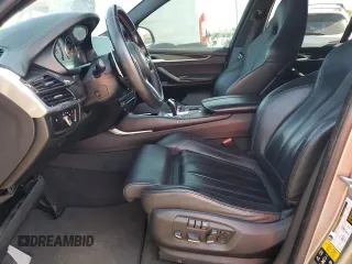2016 BMW X5 M z VIN 5YMKT6C59G0R78590, wystawiony jako Copart lot #52993985 z przebiegiem Nie podano mil oraz Tytuł czysty. Historia ofert i sprzedaży dostępna na DreamBid. Obrazek 7.