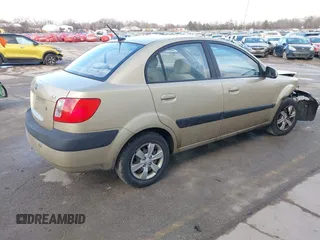 2009 Kia Rio SX with VIN KNADE223196512461, listed as a IAAI auction lot 41520063 with 132,558 mi miles. Bid and sale history available at carsss.com. Image 4.
