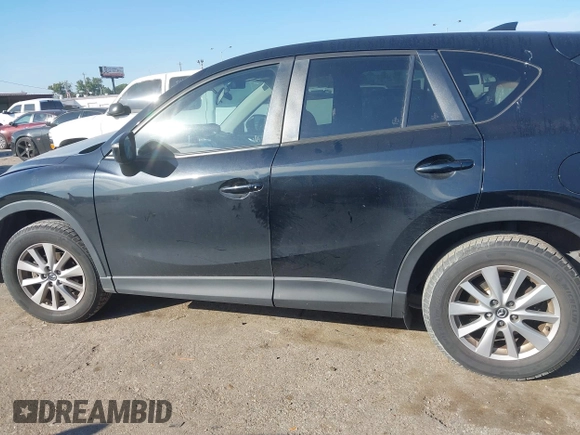 2016 Mazda CX-5 Touring with VIN JM3KE2CY6G0808992, listed as a IAAI auction lot 40969655 with 132,513 mi miles. Bid and sale history available at carsss.com. Image 14.