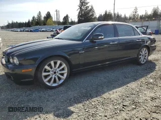 2008 Jaguar XJ with VIN SAJWA79BX8SH23430, listed as a Copart auction lot 51990785 with 140,454 mi miles and Salvage Title. Bid and sale history available at carsss.com. Image 1.