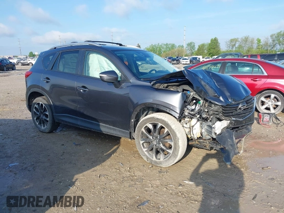 2016 Mazda CX-5 Grand Touring with VIN JM3KE4DYXG0724183, listed as a IAAI auction lot 42176009 with 152,695 mi miles and . Bid and sale history available at DreamBid. Image 1.