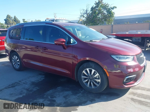2021 Chrysler Pacifica Hybrid Touring L with VIN 2C4RC1L76MR581285, listed as a IAAI auction lot 42303222 with 77,808 mi miles and . Bid and sale history available at DreamBid. Image 1.