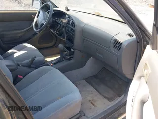 1995 Toyota Camry LE z VIN 4T1SK12E3SU576500, wystawiony jako IAAI lot #42186816 z przebiegiem 216 809 mil mil oraz . Historia ofert i sprzedaży dostępna na DreamBid. Obrazek 5.