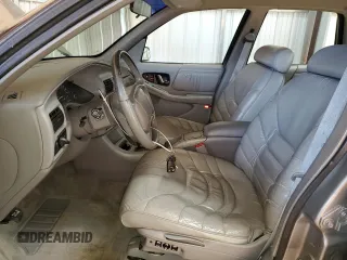 1996 Buick Regal Custom with VIN 2G4WB52KXT1523059, listed as a Copart auction lot 88440285 with 95,444 mi miles and Salvage title. Bid and sale history available at DreamBid. Image 7.