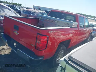 2018 Chevrolet Silverado 1500 LT with VIN 1GCUKREC0JF222376, listed as a IAAI auction lot 42121748 with 143,472 mi miles and . Bid and sale history available at DreamBid. Image 4.